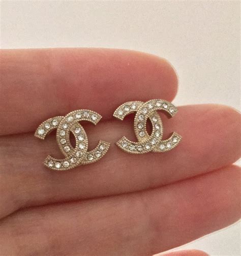 resale chanel stud earrings|authentic Chanel logo stud earrings.